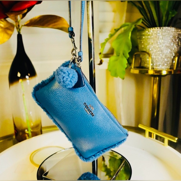 COACH Blue Shearling Pom Wristlet, EUC - Picture 2 of 5